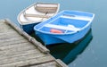 Two small rowboats tied to a wooden dock in Massachusetts Royalty Free Stock Photo