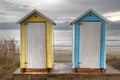 Colorful portable toilet houses on beach Royalty Free Stock Photo