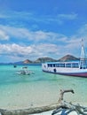 Two small boats leaning on the beach