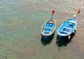 Two small boats moored together on Mediterranean sea in Cinque T