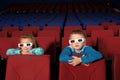 Two small children in 3D glasses watching a movie Royalty Free Stock Photo