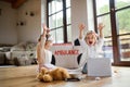 Two small children with doctor uniforms indoors at home, having fun when playing.