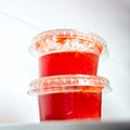 Two small chilly sauce containers in a fridge Royalty Free Stock Photo
