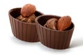 Two small chocolate baskets with cream and nut Royalty Free Stock Photo