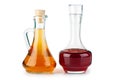 Two small decanters with apple and red wine vinegar Royalty Free Stock Photo