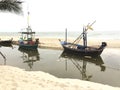 Two small fishing boats wait out for fishing.