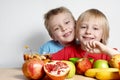 Two small friends with fruit Royalty Free Stock Photo