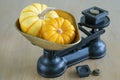 Two small pumpkins on a retro scales