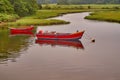 Two small red boats on a river Royalty Free Stock Photo