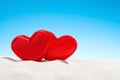 Two small red hearts on beach Royalty Free Stock Photo