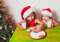 Two girls near Christmas tree Royalty Free Stock Photo