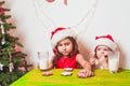 Two girls near Christmas tree Royalty Free Stock Photo