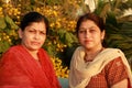 Two smart Indian housewives Royalty Free Stock Photo