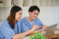 Two smart medical students are studying and doing a medical project at the library together Royalty Free Stock Photo