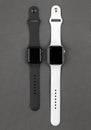 Two smart watches.Apple Watch on a gray background. Royalty Free Stock Photo