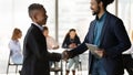 Two smiling black businessmen shaking hands after making good deal Royalty Free Stock Photo