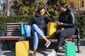 Two Smiling Black Girlfriends Shopping and Chatting Royalty Free Stock Photo