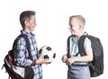 Two smiling boys playing together at school. Two friends talking together isolated on a white background