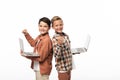 Two smiling brothers holding laptops, showing thumbs up and looking at camera Royalty Free Stock Photo