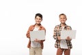 Two smiling brothers holding laptops and smiling at camera Royalty Free Stock Photo