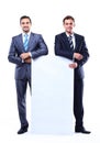 Two smiling business man showing blank signboard Royalty Free Stock Photo