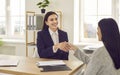 Two smiling businesswomen shaking hands after successful job interview Royalty Free Stock Photo