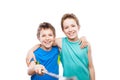 Two smiling child boy brothers holding mobile phone or smartphone selfie stick taking portrait photo Royalty Free Stock Photo