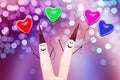 Two smiling fingers with a ballons on a pink background bokeh Royalty Free Stock Photo