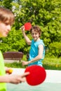 Two smiling friends playing together ping pong Royalty Free Stock Photo