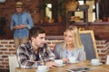 Two smiling friends talking and drinking coffee Royalty Free Stock Photo