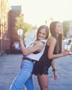 Two smiling girl friends in city Royalty Free Stock Photo