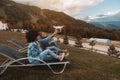 Two smiling girls of different races holding flying drone