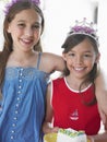 Two Smiling Girls In Tiaras