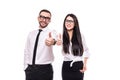 Two smiling happy businesspeople in formalwear showing thumbs-up on white background Royalty Free Stock Photo