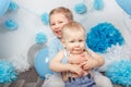 Two smiling laughing hugging cute adorable Caucasian children, toddler girl and baby boy, celebrating birthday Royalty Free Stock Photo