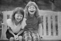 Two smiling laughing kids relaxing outdoors at summer park. Brother and sister happy walking in nature. Siblings boy and Royalty Free Stock Photo