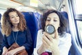 Two smiling lovely girls while they makeup Royalty Free Stock Photo