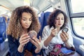 Two smiling lovely girls while they makeup Royalty Free Stock Photo