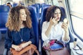 Two smiling lovely girls while they makeup Royalty Free Stock Photo