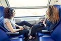 Two smiling lovely girls talk to each other Royalty Free Stock Photo