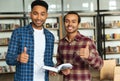 Two smiling multicultural male students getting ready for exams Royalty Free Stock Photo