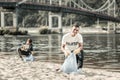 Two smiling responsible students cleaning up trash left behind on the beach Royalty Free Stock Photo