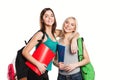 Two smiling students girl with school bags on Royalty Free Stock Photo