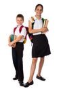 Two smiling students standing with books in hands Royalty Free Stock Photo
