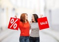 Two smiling teenage girl with shopping bags Royalty Free Stock Photo