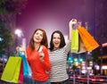 Two smiling teenage girls with shopping bags Royalty Free Stock Photo