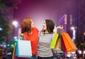 Two smiling teenage girls with shopping bags Royalty Free Stock Photo