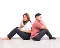 Two smiling woman young girls and happiness tomboy friends sitting back to back on floor with white background Royalty Free Stock Photo