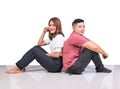 Two smiling woman young girls and happiness tomboy friends sitting back to back on tile floor in home with white background Royalty Free Stock Photo