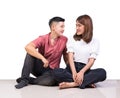 Two smiling woman young girls and happiness tomboy friends sitting on tile floor with white background Royalty Free Stock Photo